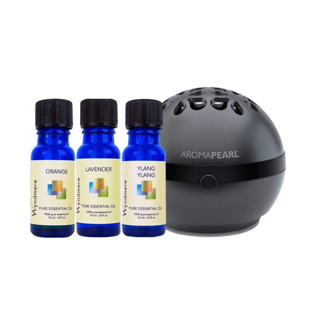 Orange, Lavender, and Ylang Ylang essential oils, White AromaPearl diffuser on a Black background.