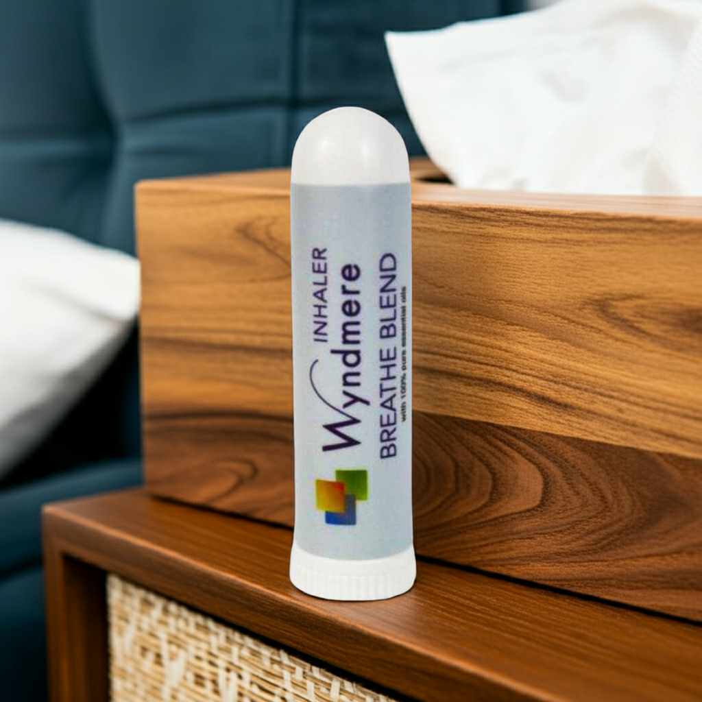 Wyndmere Inhaler on a wooden surface with a blurred background