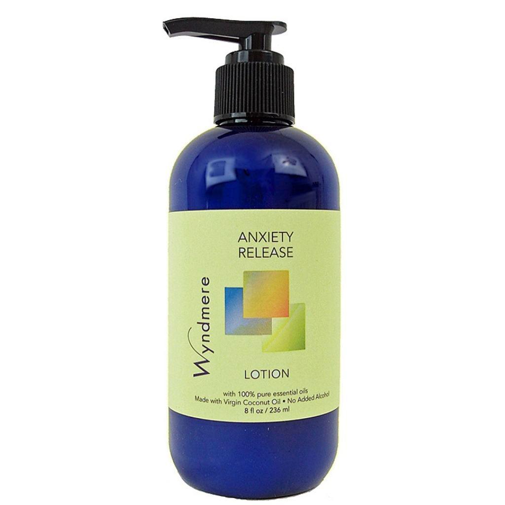 An 8oz cobalt blue bottle of Wyndmere Anxiety Release Lotion