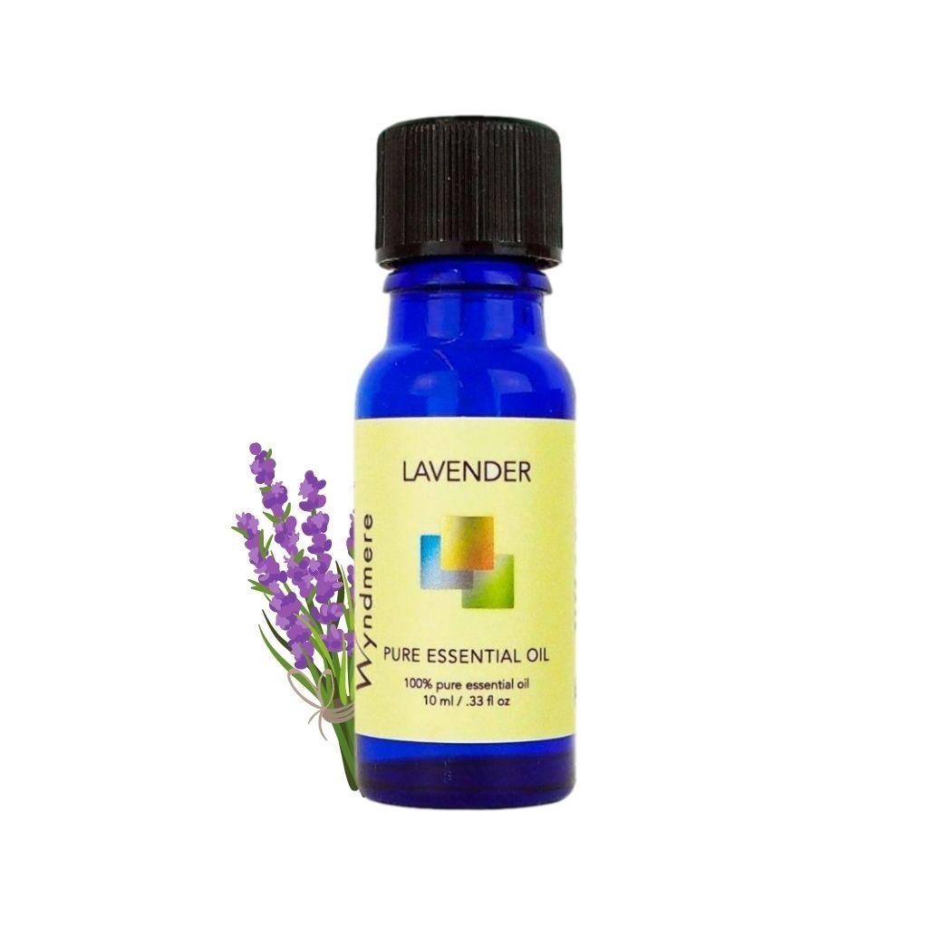 10ml cobalt blue bottle of Lavender essential oil with sprig of Lavender flower