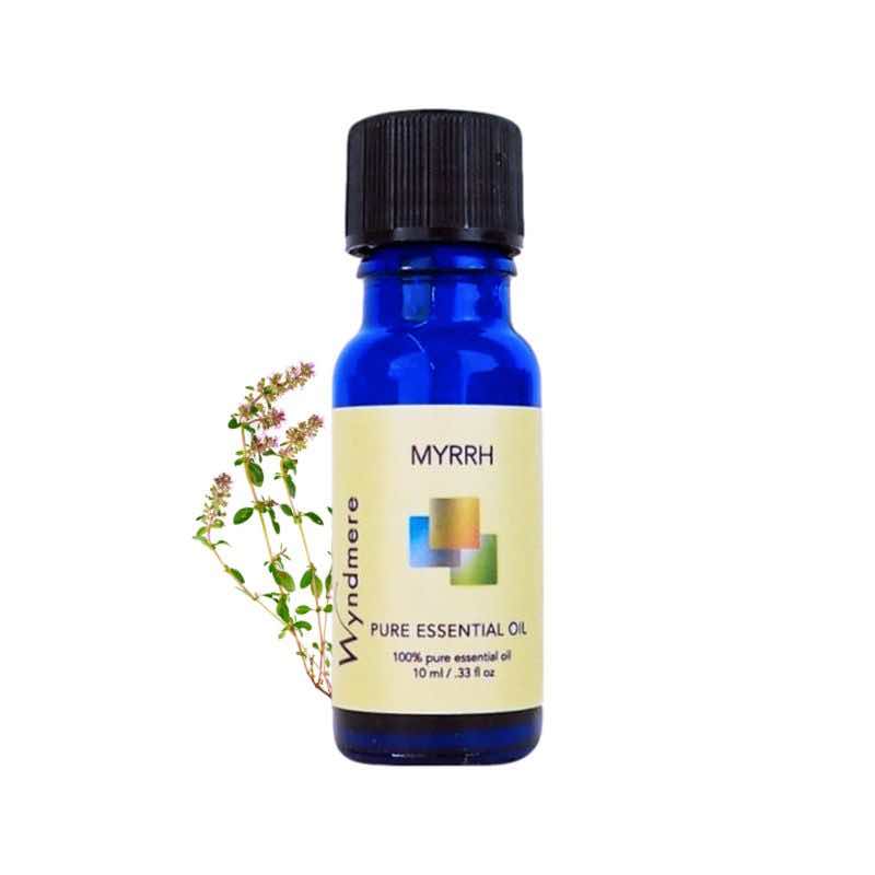 Myrrh plant leaves with a 10ml cobalt blue bottle of Wyndmere Myrrh Essential Oil