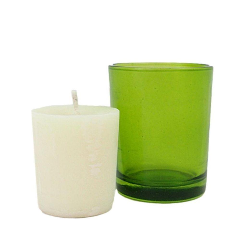 Wyndmere Stress Relief votive candle next to a green straight walled votive candle holder
