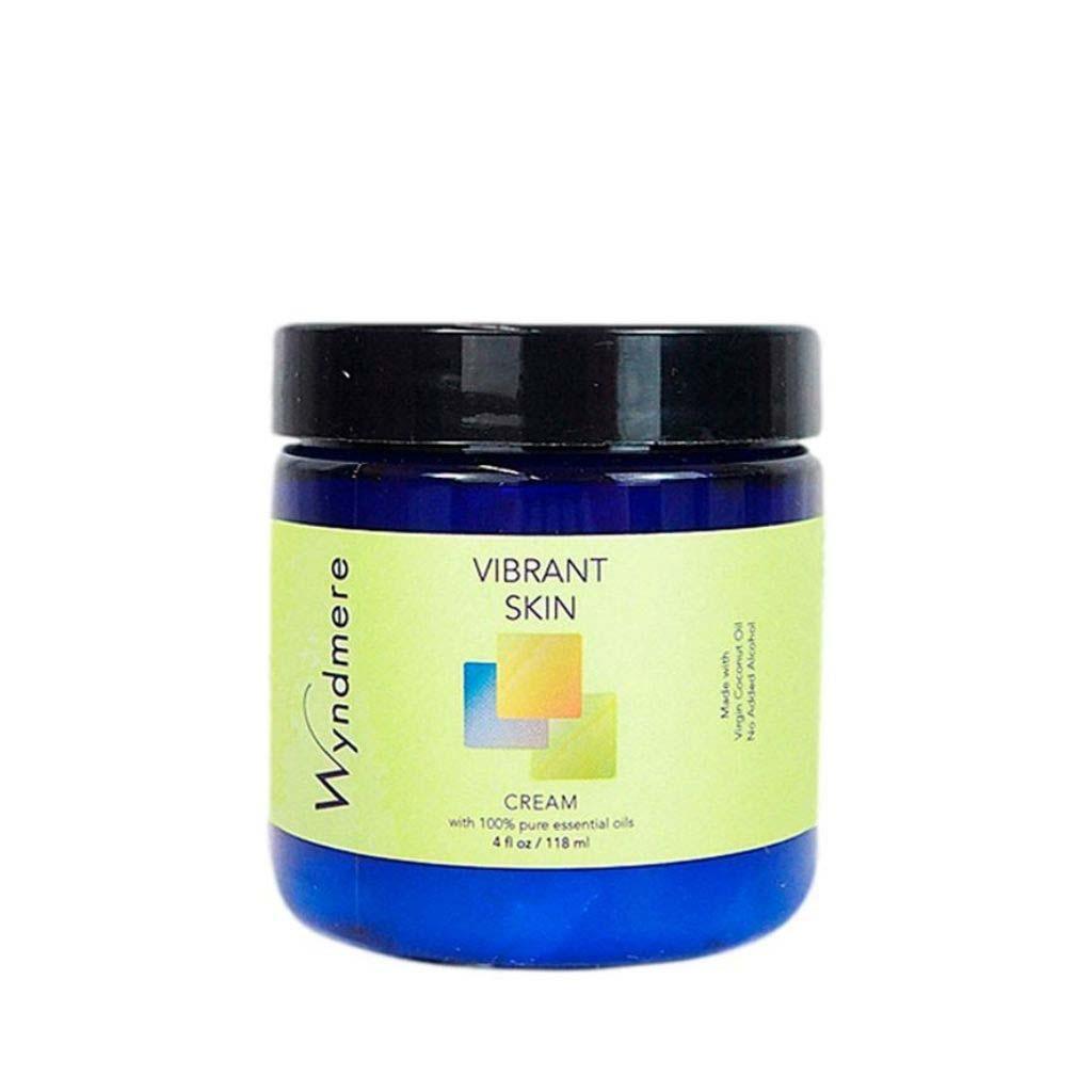 A 4oz cobalt blue jar of Wyndmere Vibrant Skin cream