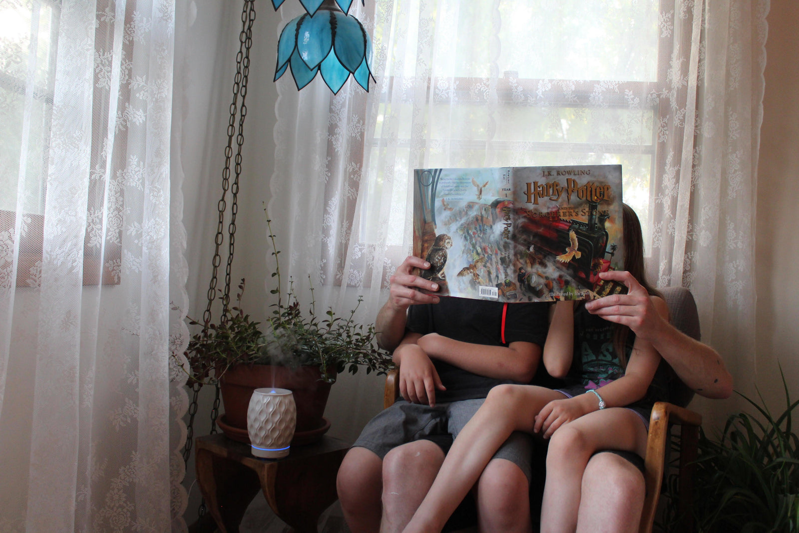 Father reading to children.