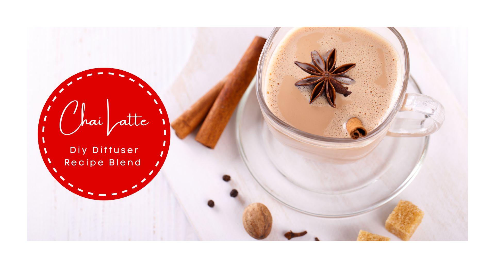 Wyndmere Naturals - Chai Latte diffuser recipe blend. Cup of chai latte and cinnamon sticks and cloves background.