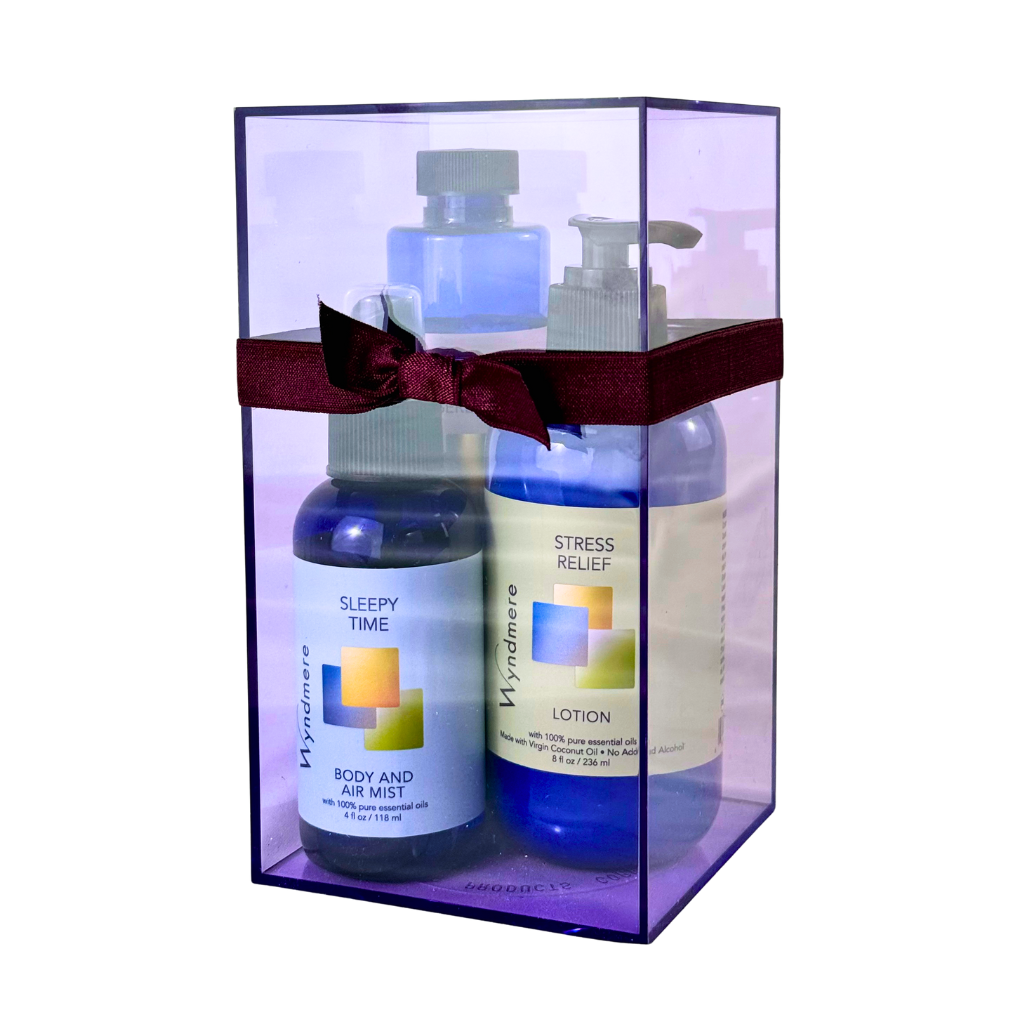 Three bottles of Wyndmere skin-care products in a clear gift box with a red ribbon.