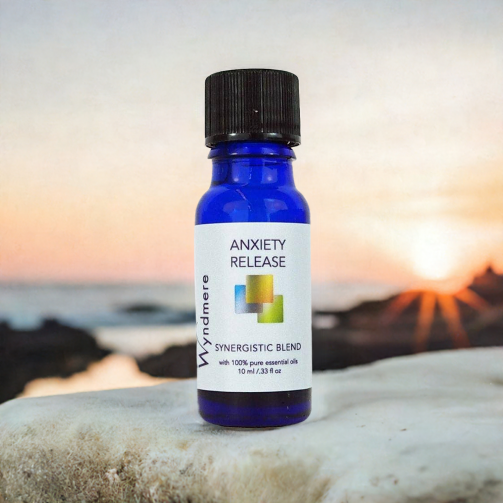 Bottle of Wyndmere Anxiety Release blend on a rock with a sunset background