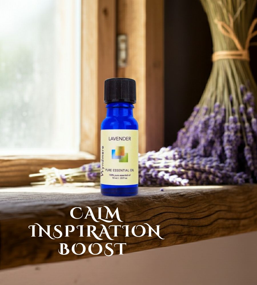 Lavender essential oil bottle on a wooden surface with lavender flowers in the background.