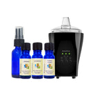 Orange, Lavender, and Ylang Ylang essential oils, and a glass cobalt blue spray bottle, AromaSens diffuser on a white background..