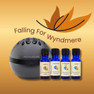 Aroma Pearl diffuser with Wyndmere essential oil bottles on a beige background