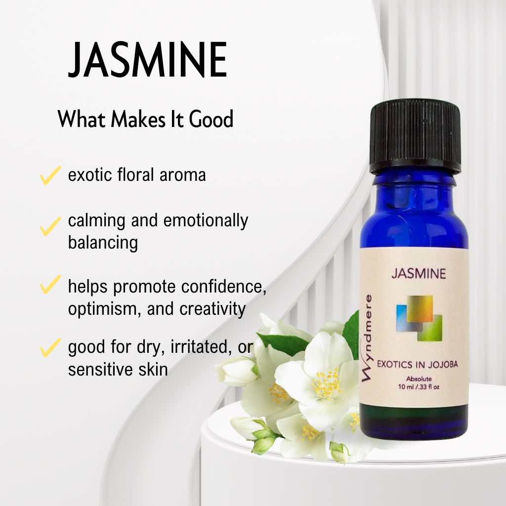 Cobalt blue bottle of Jasmine essential oil with jasmine flowers and text about its benefits on a white background