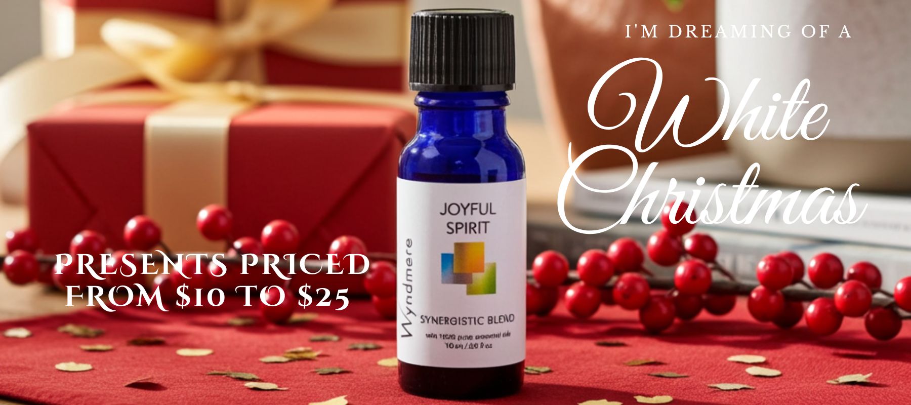 Bottle of 'Wyndmere Joyful Spirit' essential oil blend with Christmas decorations and text about gift prices.