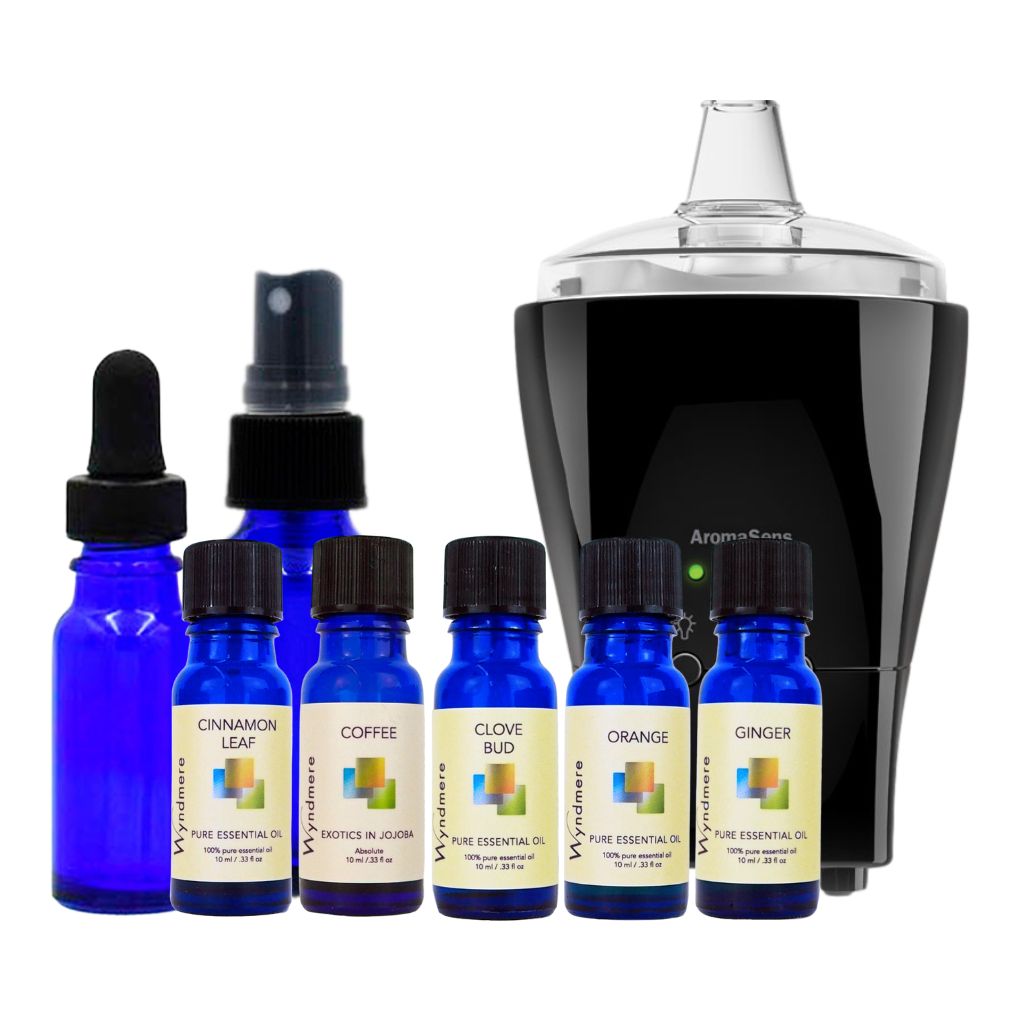Set of blue essential oil bottles with yellow labels. The set includes a blue glass 1/2 oz dropper bottle, a blue glass 1 oz mist bottle, and an AromaSens diffuser on a white background - Wyndmere