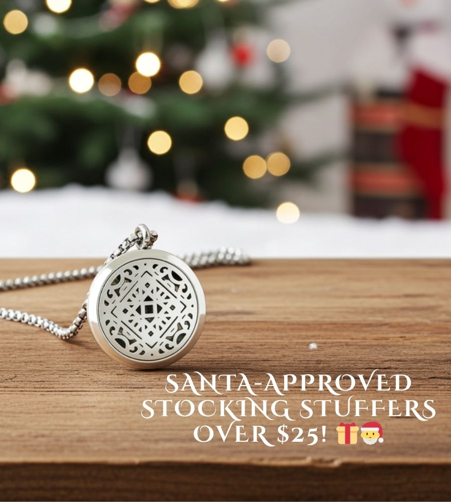 Wyndmere Venice Aromatherapy ilver necklace with decorative pendant on a wooden surface with a Christmas tree in the background