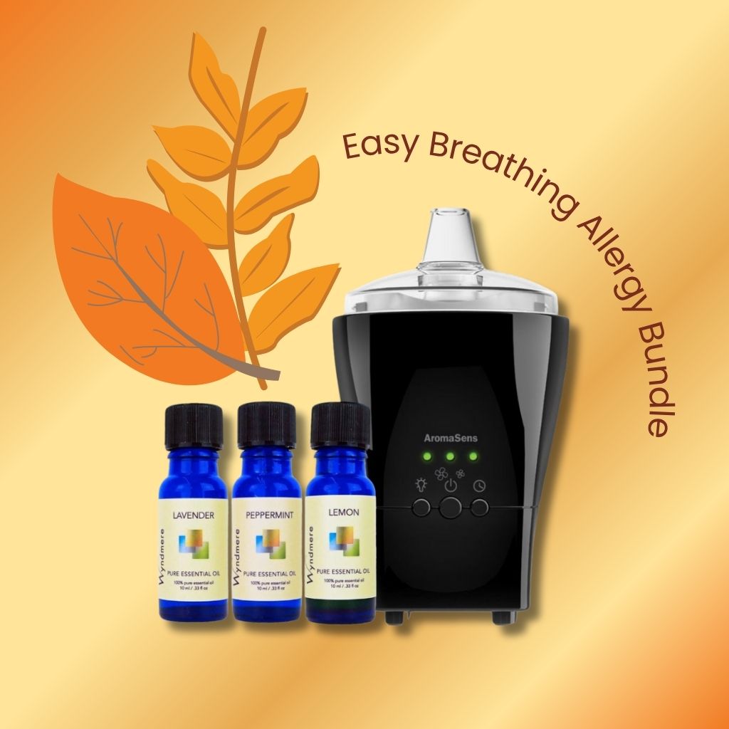 An AromaSens essential oil diffuser and Wyndmere essential oil bottles with a leaf graphic on an orange background