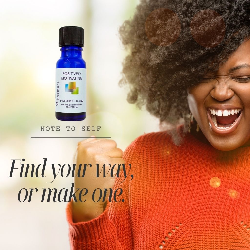 Wyndmere Positively Motivating essential oil blend caption: Find your way positively Motivating. With an excited woman pictured.
