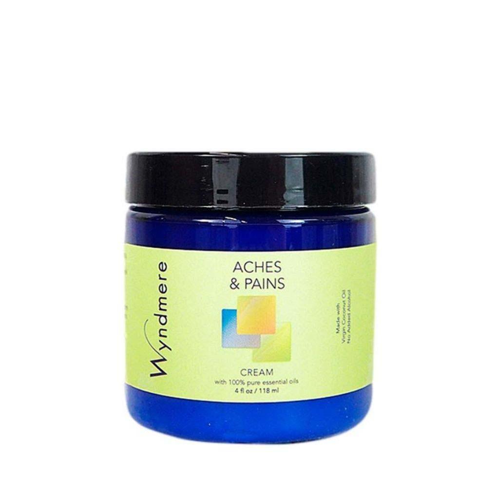 A 4oz cobalt blue jar of Wyndmere Aches &amp; Pains cream made with the best essential oils for sore muscles