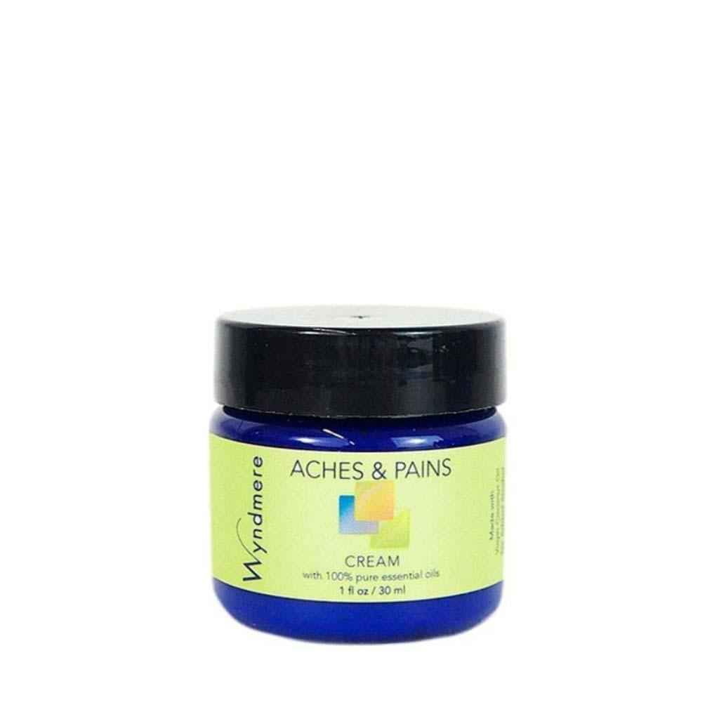 A 1oz cobalt blue jar of Wyndmere Aches & Pains cream