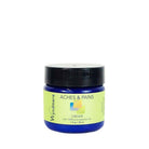 A 1oz cobalt blue jar of Wyndmere Aches & Pains cream