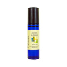 An 8ml cobalt blue roll-on bottle of Wyndmere Aches & Pains blend