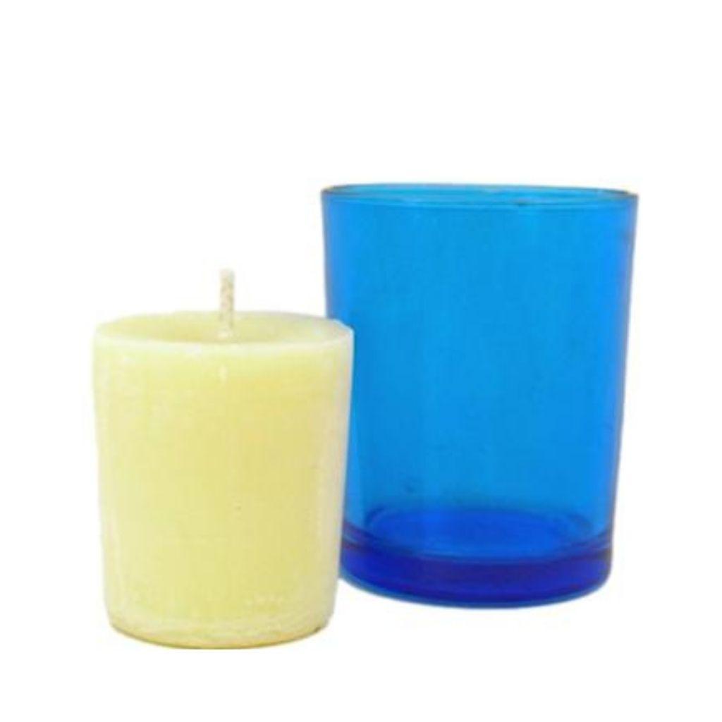 Anxiety Release votive candle next to blue straight walled votive candle holder