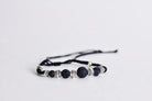 adjustable black corded aromatherapy bracelet with black lava beads