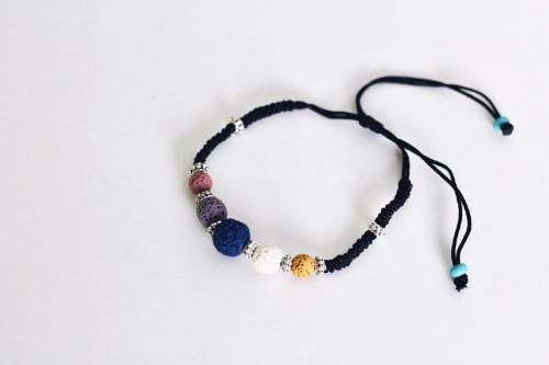 adjustable black corded aromatherapy bracelet with colorful lava beads