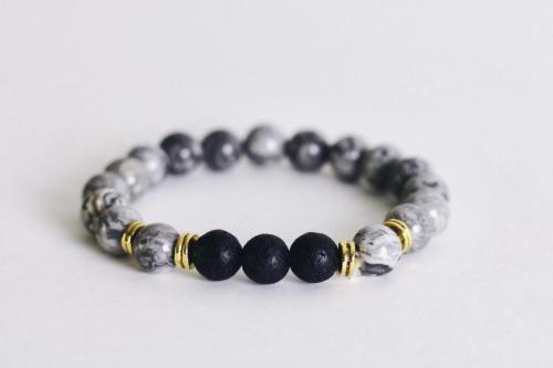 gray beaded aromatherapy bracelet with black lava stones with gold accents
