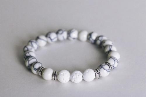 white beaded aromatherapy bracelet with white lava stones and silver accents