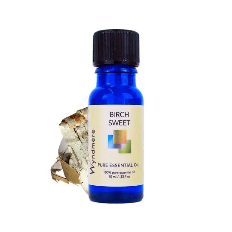 Birch bark with a 10ml cobalt blue bottle of Wyndmere Sweet Birch Essential Oil. Sold with childproof cap.