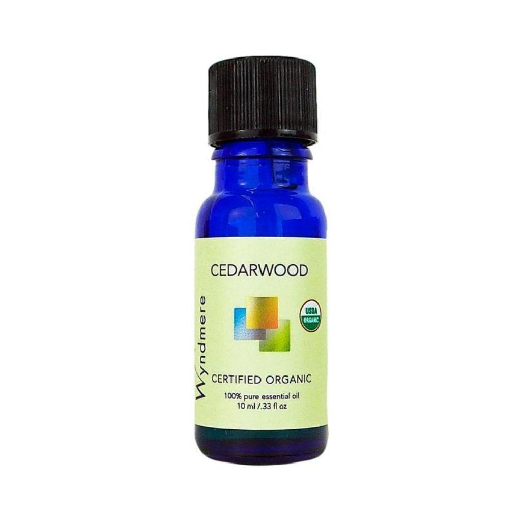 Cedarwood - 10ml cobalt blue bottle of Wyndmere Certified Organic Cedarwood Essential Oil that has a woody, calming aroma