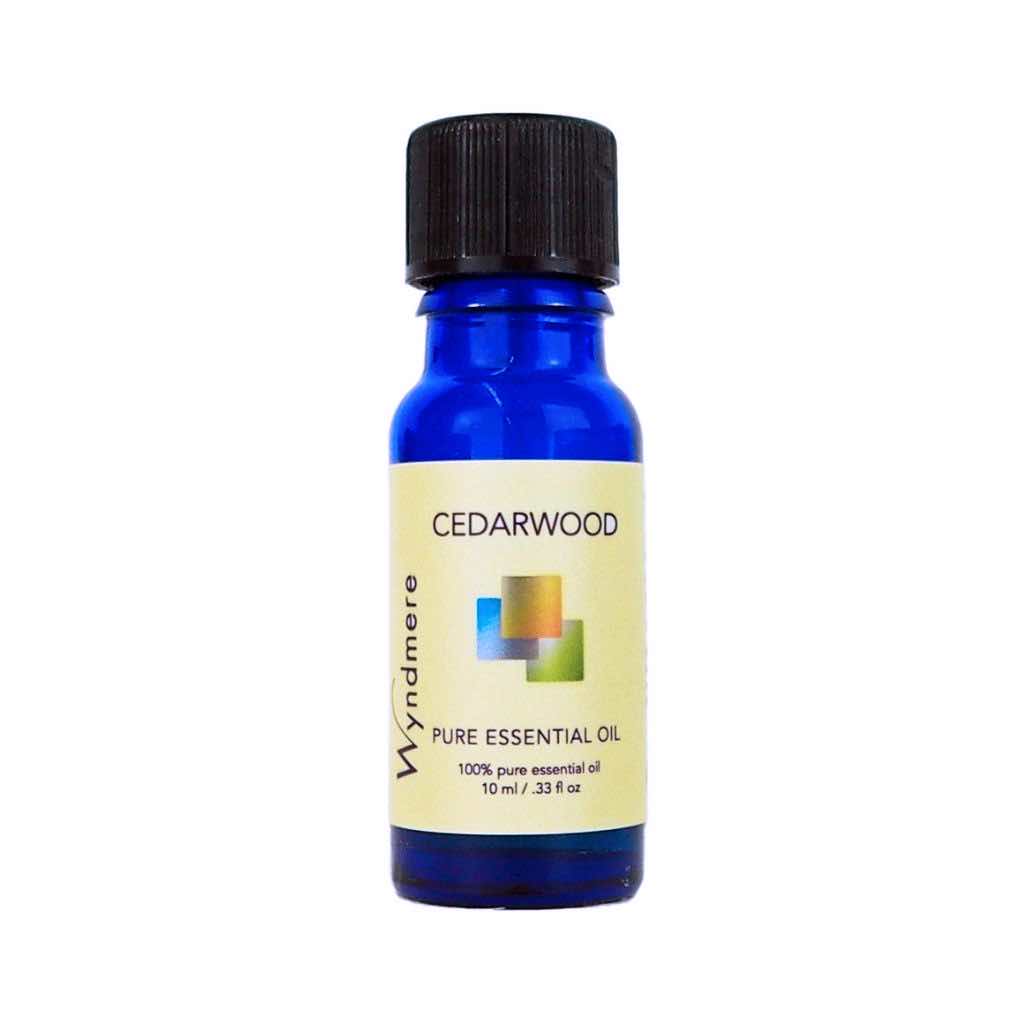 Cedarwood - 10ml cobalt blue bottle of Wyndmere Cedarwood Essential Oil that has a woody aroma