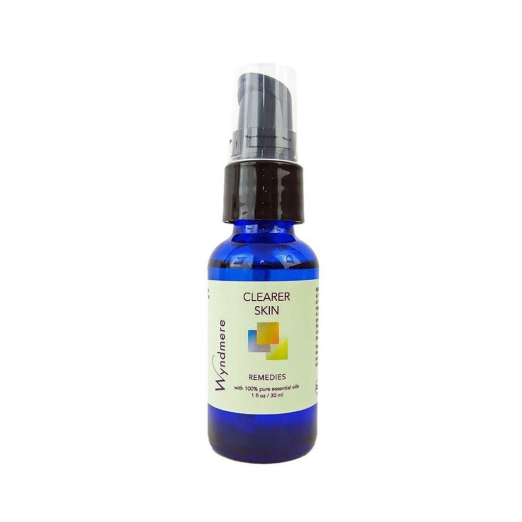 1oz cobalt blue bottle of Wyndmere Clearer Skin remedy with treatment pump
