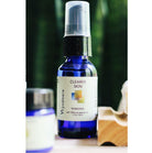 Bottle of Clearer Skin remedy near jar of cream and bar of soap