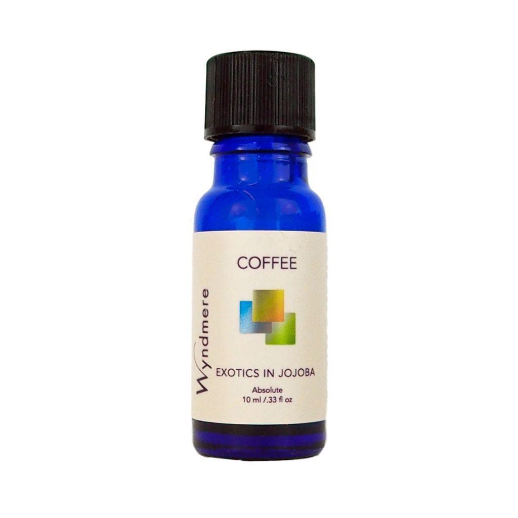 Coffee beans with Coffee Oil diluted in Jojoba in a 10ml cobalt blue bottle
