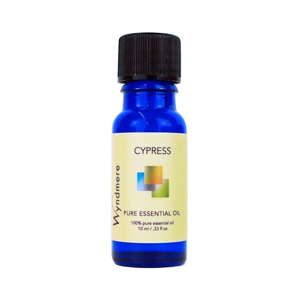 Cypress - Blue bottle of Wyndmere Cypress Essential Oil with a refreshing, pine, woody aroma that helps soothe anger