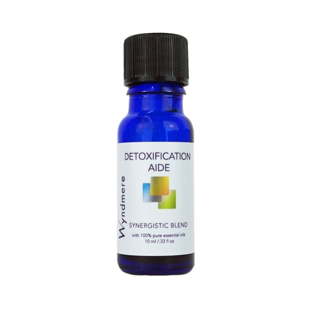 Detoxification Aide essential oil blend in a 10ml cobalt blue bottle to help detox the body naturally