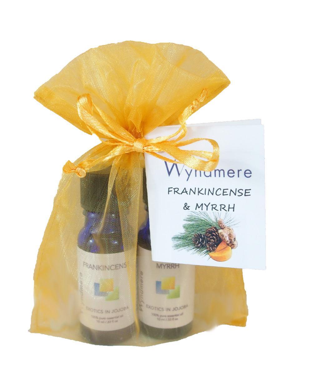 Frankincense and Myrrh essential oils in a gold organza bag for holiday gift giving