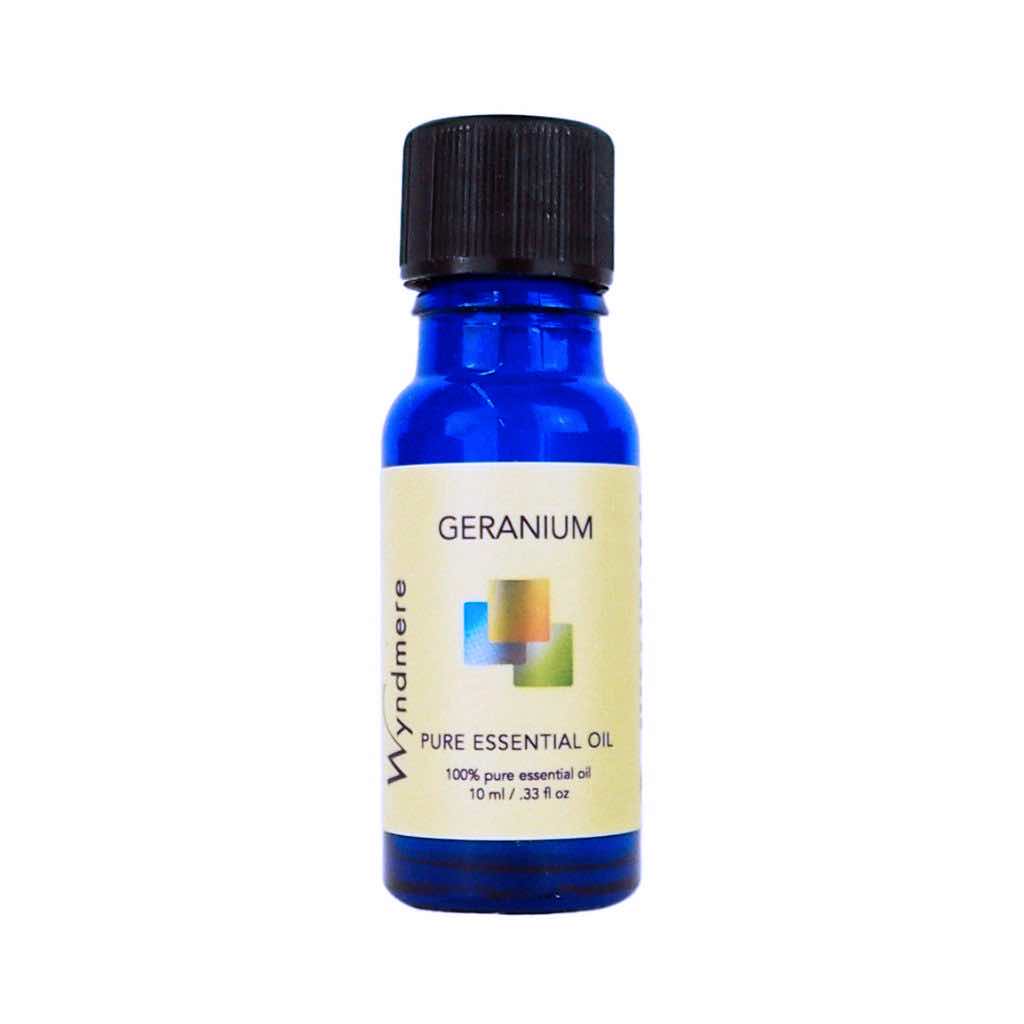 Geranium - 10ml cobalt blue bottle of Wyndmere Geranium Essential Oil having sweet, floral, uplifting aroma
