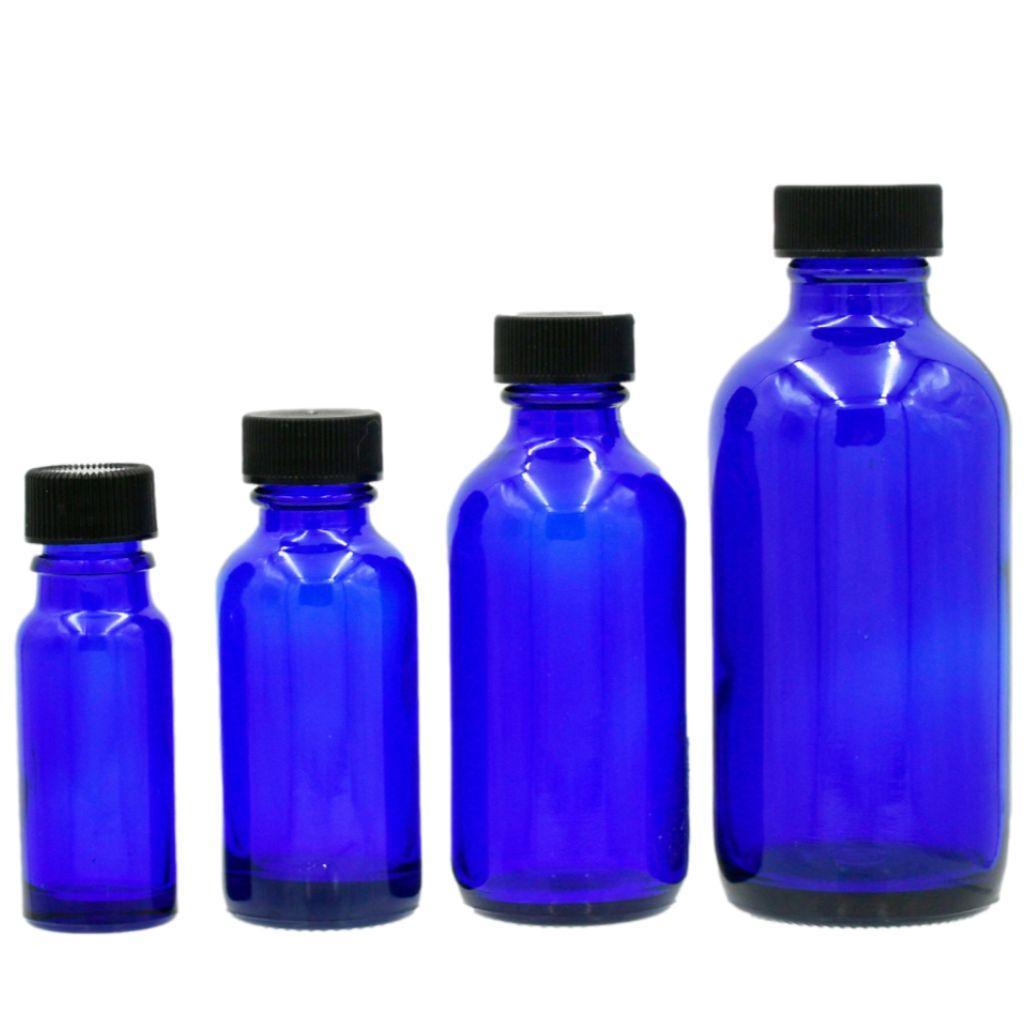 Group of multiple sizes of cobalt blue boston round glass bottle with black cap