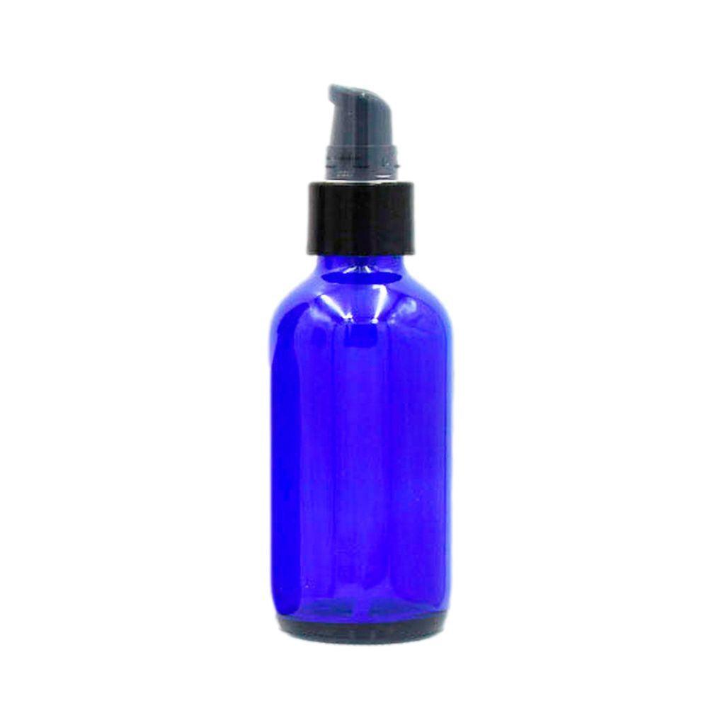4oz cobalt blue boston round glass bottle with black smooth walled treatment pump and clear hood