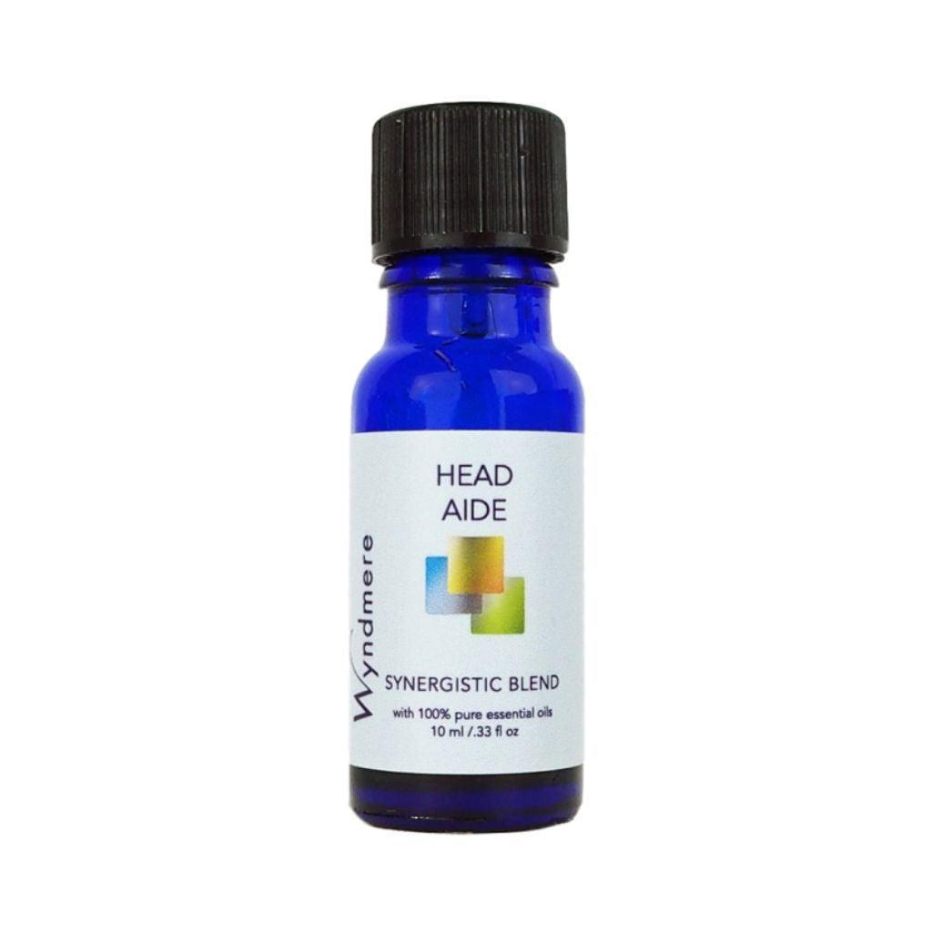 Head Aide essential oil blend in a 10ml cobalt blue bottle made with essential oils to help relieve stress and tension.