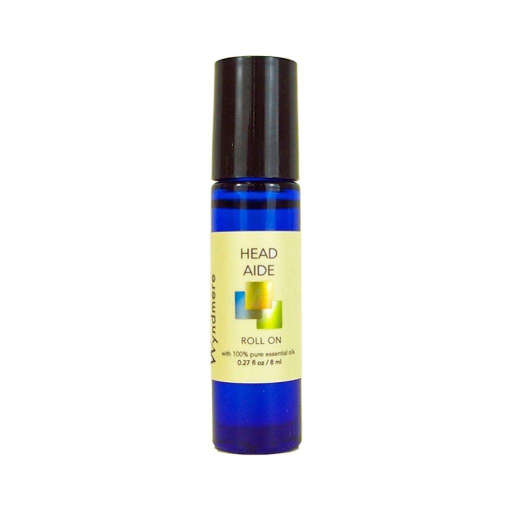 An 8ml cobalt blue roll-on bottle of Head Aide blend using the best essential oils for tension