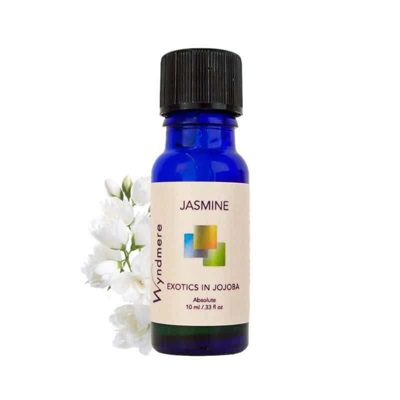 Jasmine flowers with Wyndmere Jasmine Oil diluted in Jojoba in a 10ml cobalt blue bottle
