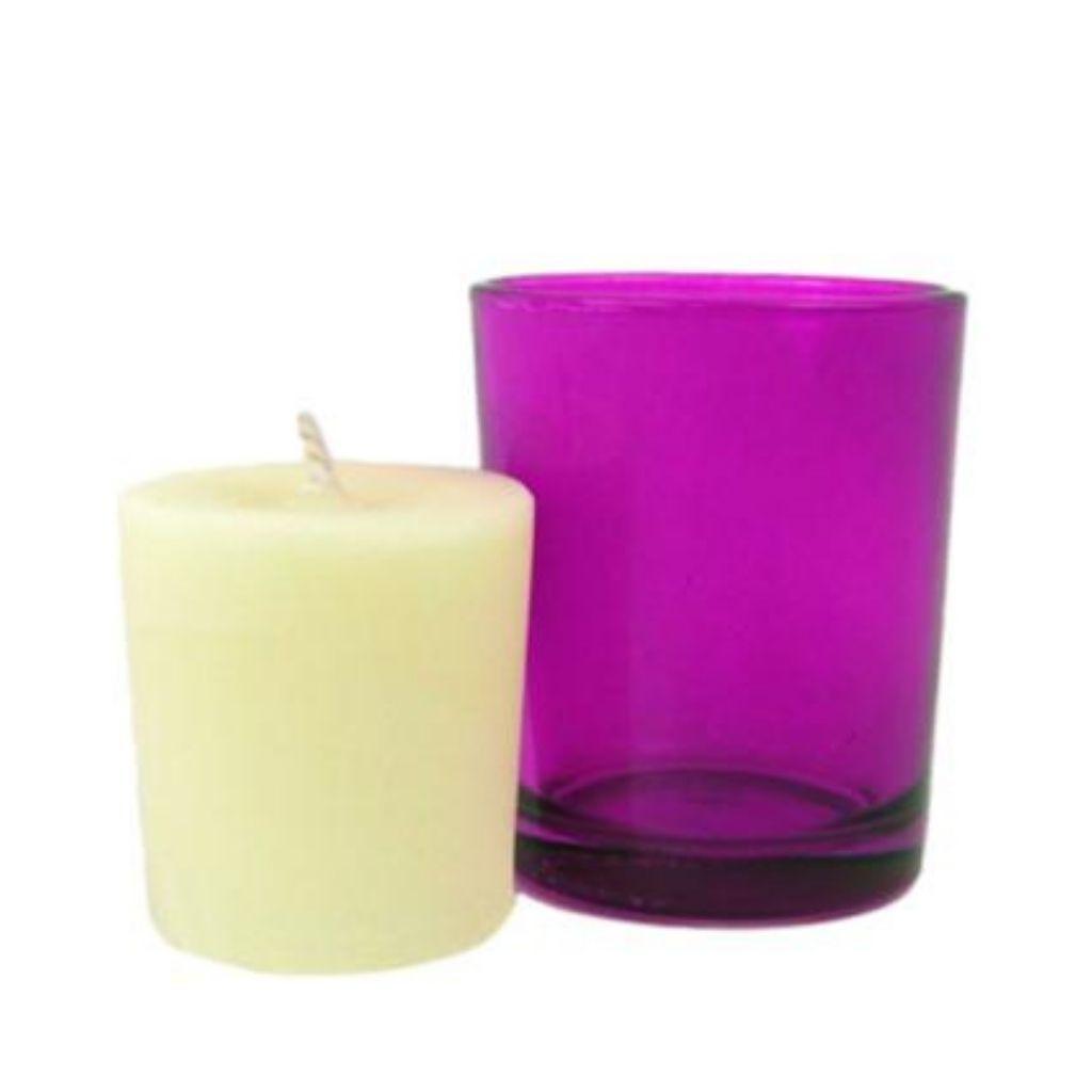 Lavender Garden votive candle next to purple straight walled votive candle holder