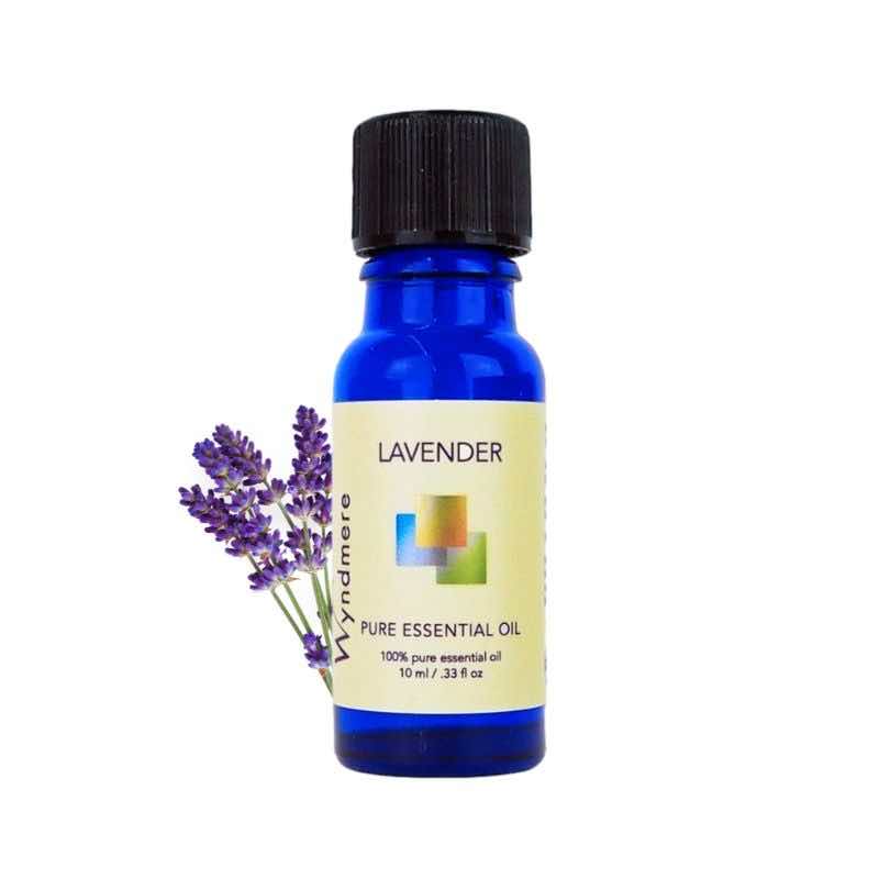 Lavender flower top with a 10ml cobalt blue bottle of Wyndmere Lavender Essential Oil