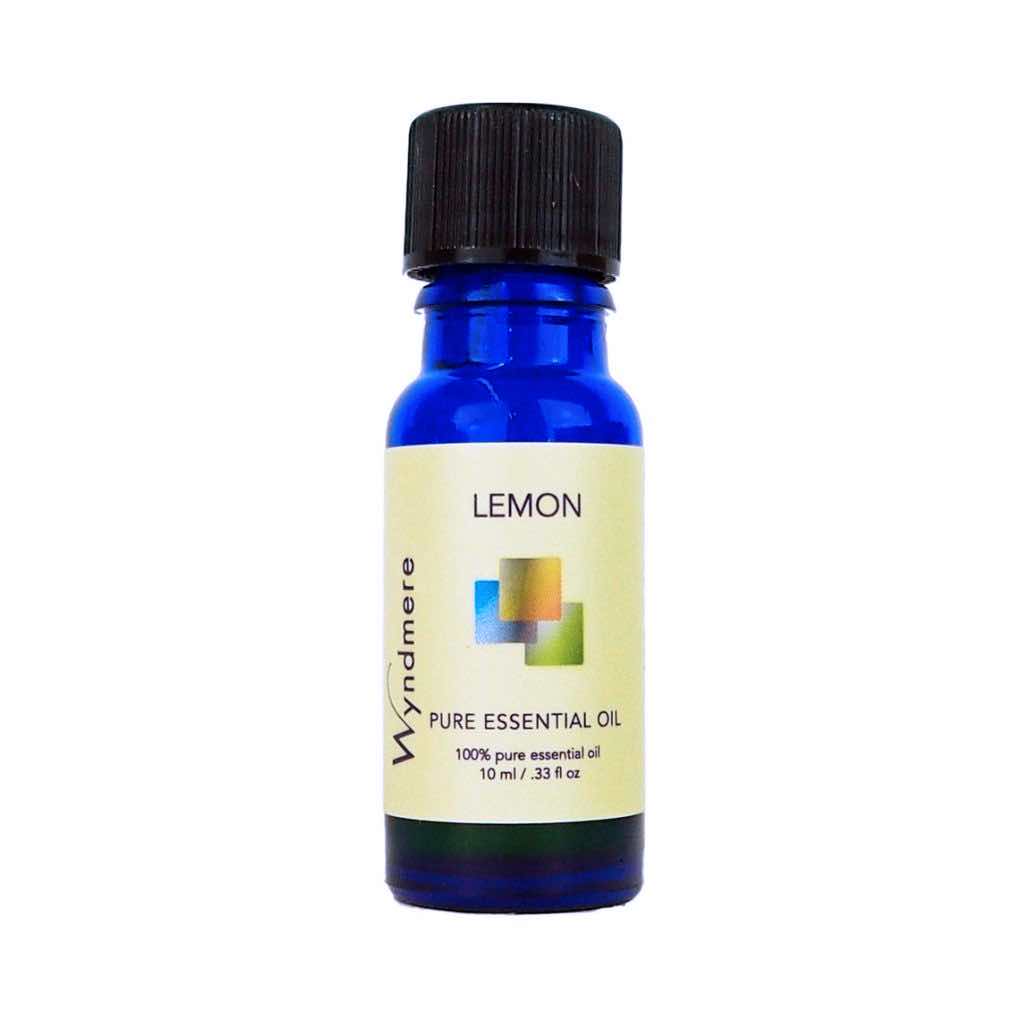 Lemon - 10ml cobalt blue bottle of Wyndmere Lemon Essential Oil that has a citrus, uplifting aroma