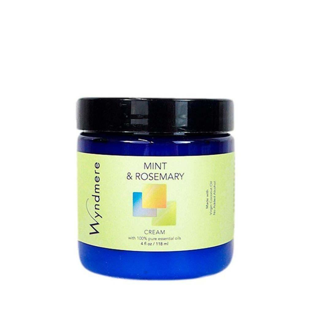 A 4oz cobalt blue jar of Wyndmere Mint & Rosemary cream