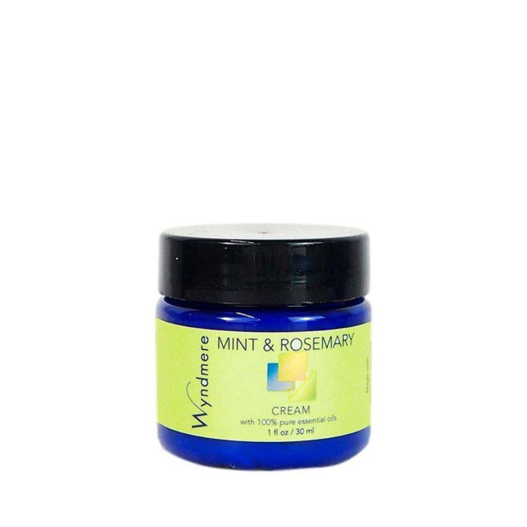 A 1oz cobalt blue jar of Wyndmere Mint & Rosemary cream