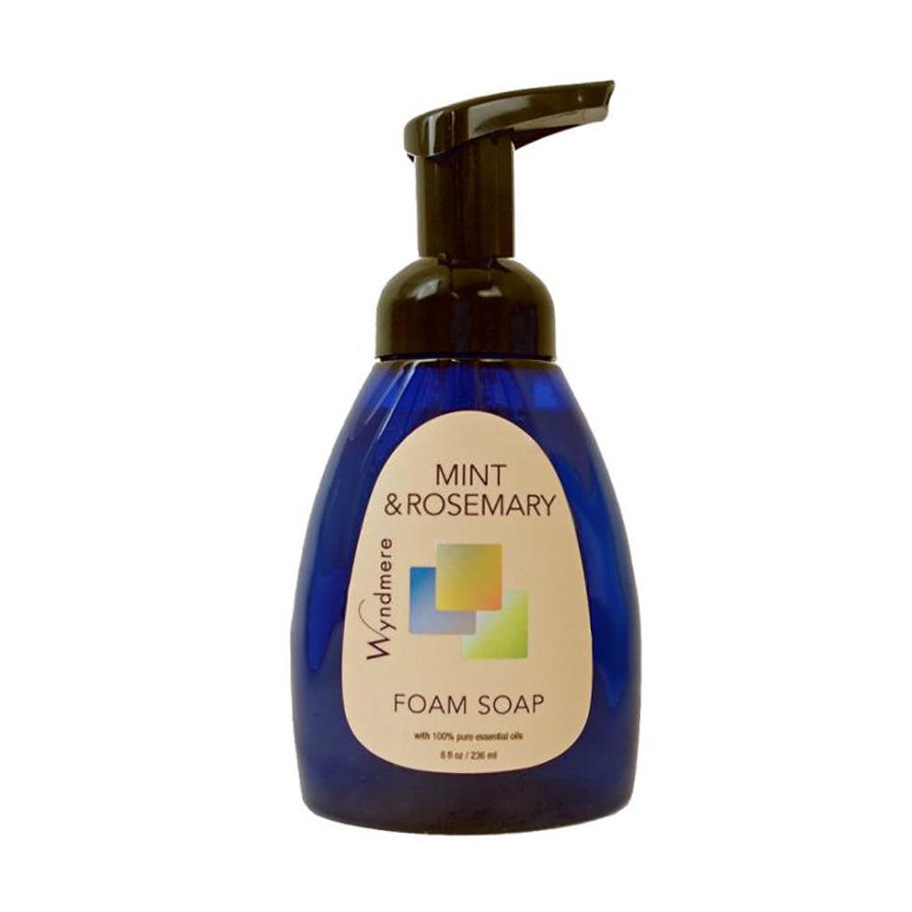 Mint &amp; Rosemary Foam Soap in a cobalt blue bottle